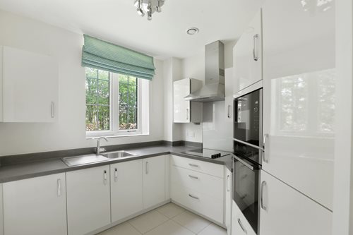 a kitchen with white cabinets