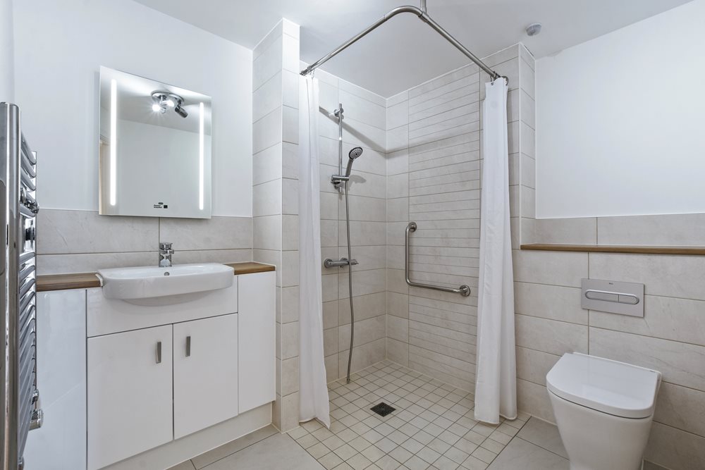 a bathroom with a shower and sink