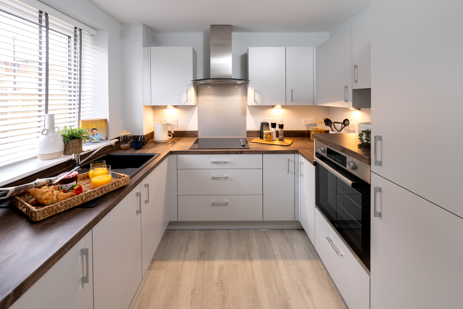 a kitchen with white cabinets