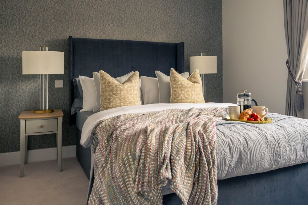 a bed with a white bed spread
