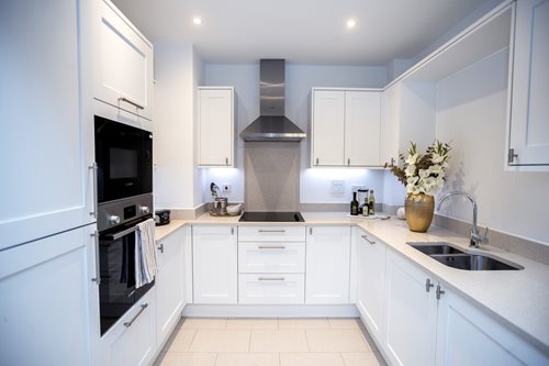 a kitchen with white cabinets