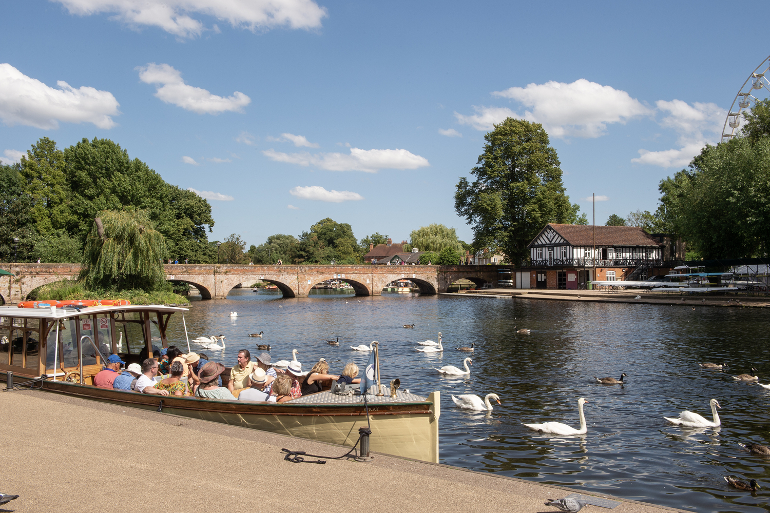 a boat full of people on a river