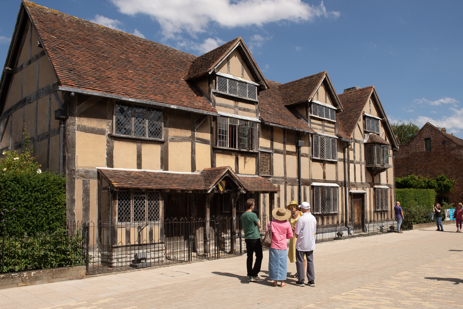 a group of people outside Shakespeare's Birthplace