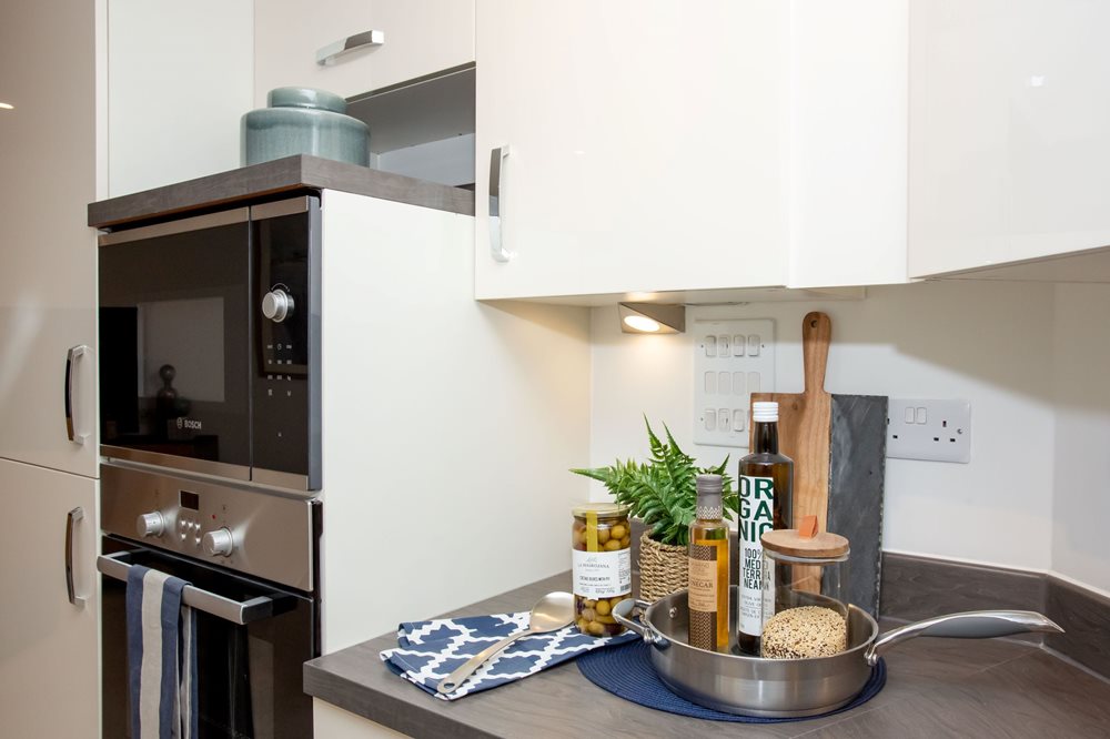 a kitchen with a table and a stove