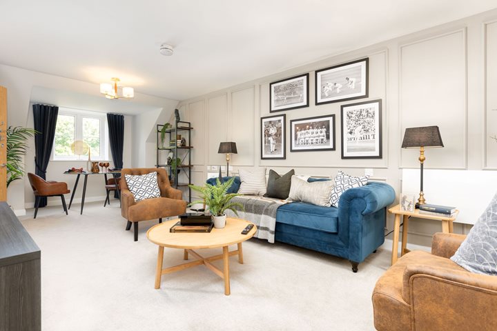 a living room with a couch and chairs