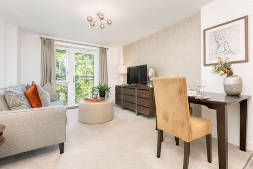 a living room with a table and chairs