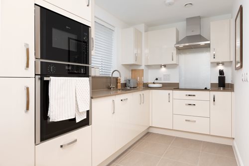 a kitchen with white cabinets