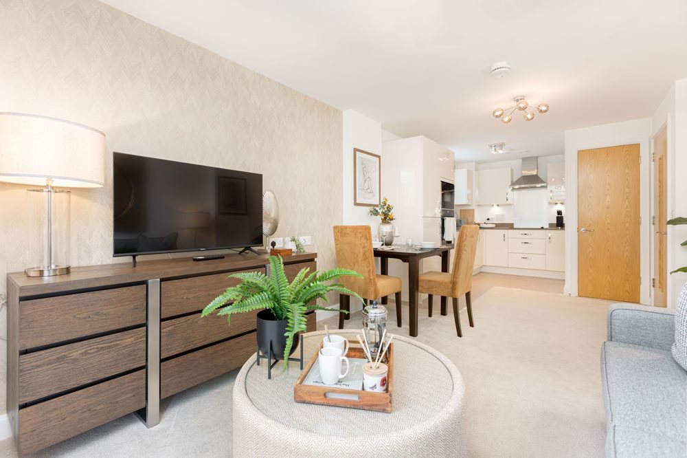 a living room with a tv and a table