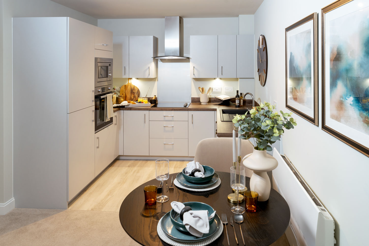 a kitchen with a table and chairs