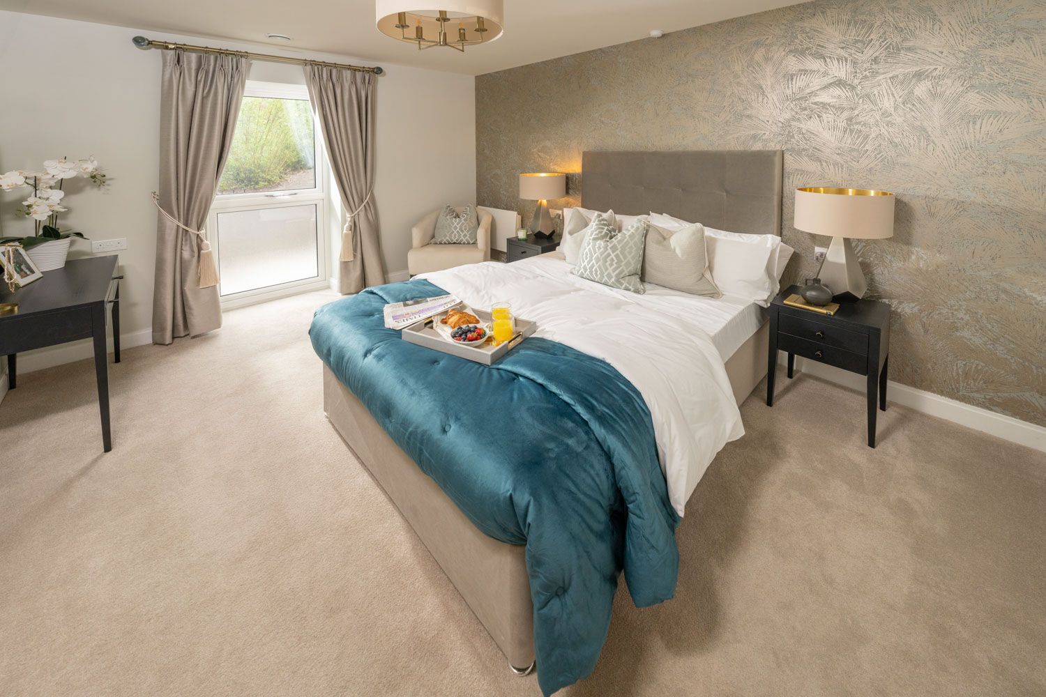 a bedroom with a bed and a table