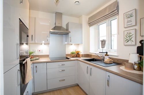 a kitchen with white cabinets