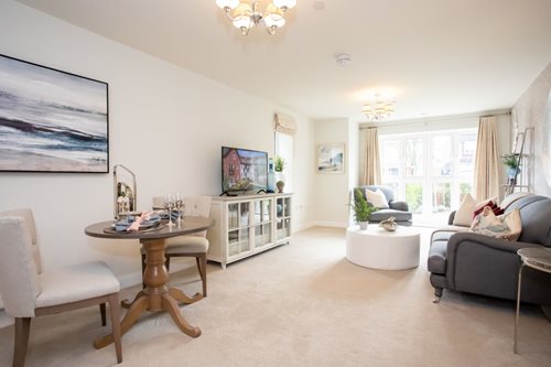 a living room with a tv and couches