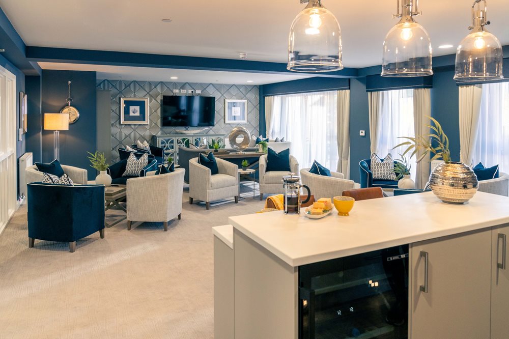 a living room with a kitchen and dining area