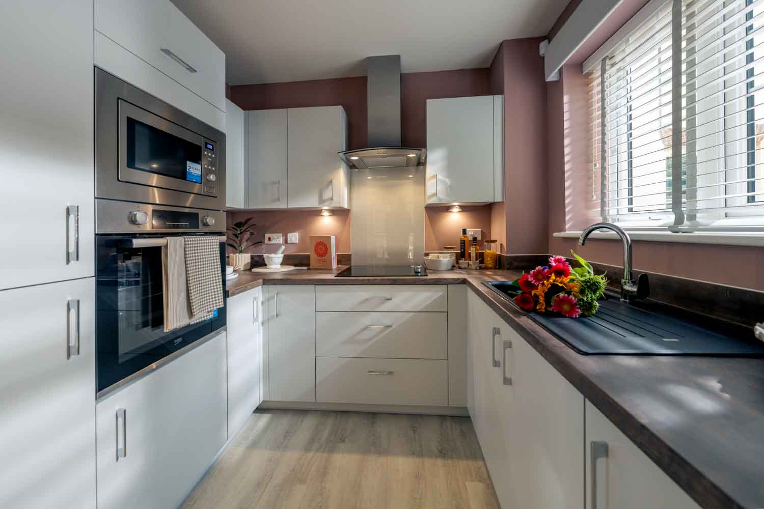 a kitchen with white cabinets