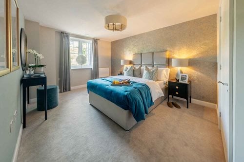 a bedroom with a bed and a desk
