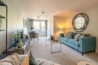 a living room with a blue couch