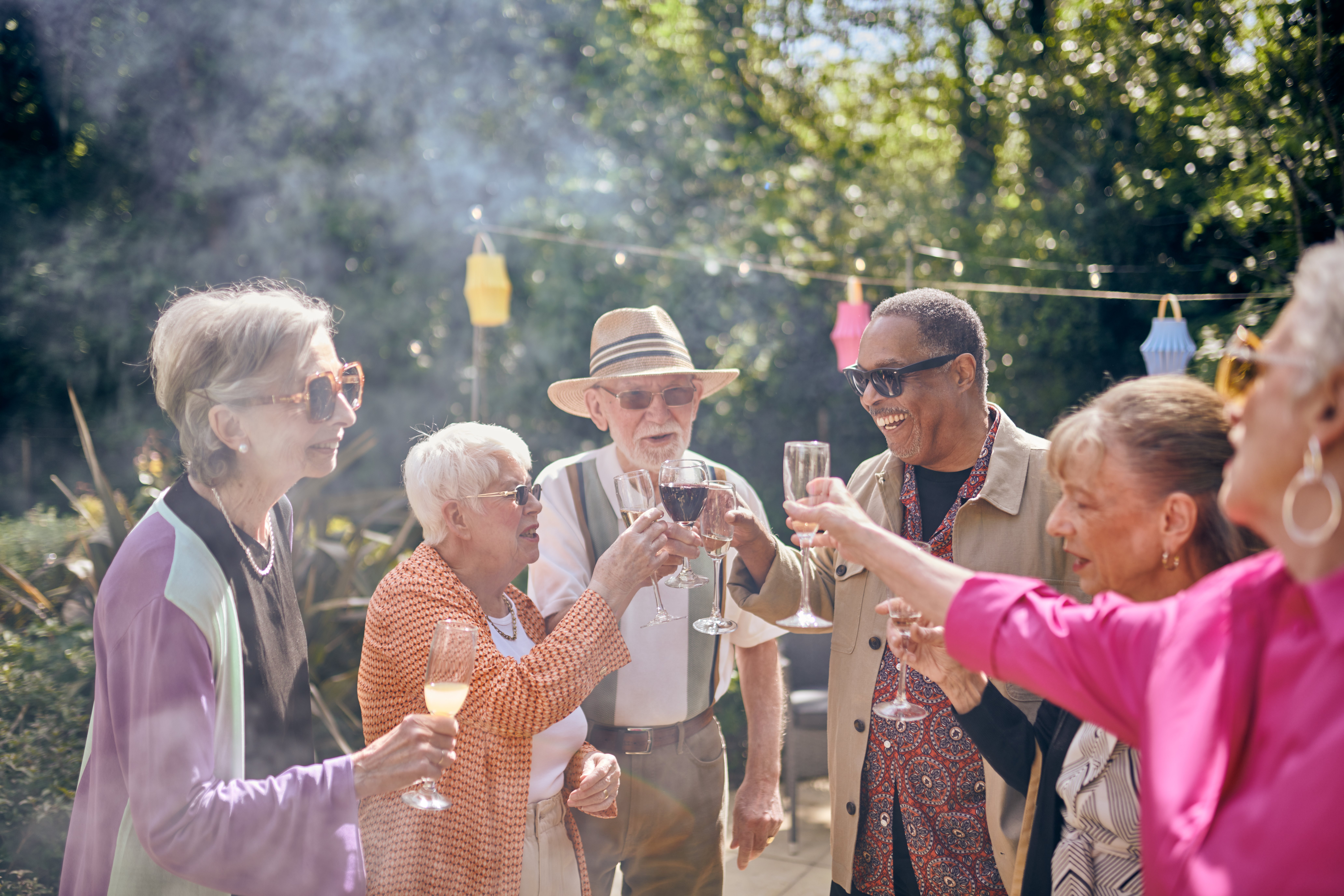a group of people holding wine glasses