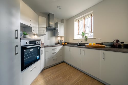 a kitchen with white cabinets