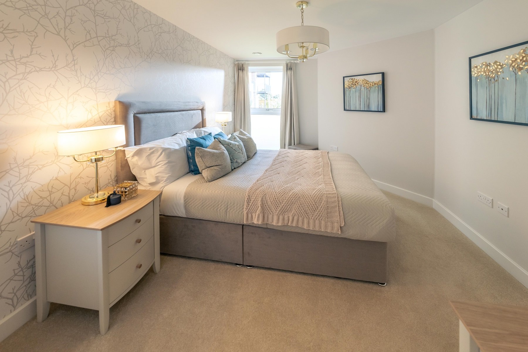 a bedroom with a bed and a desk