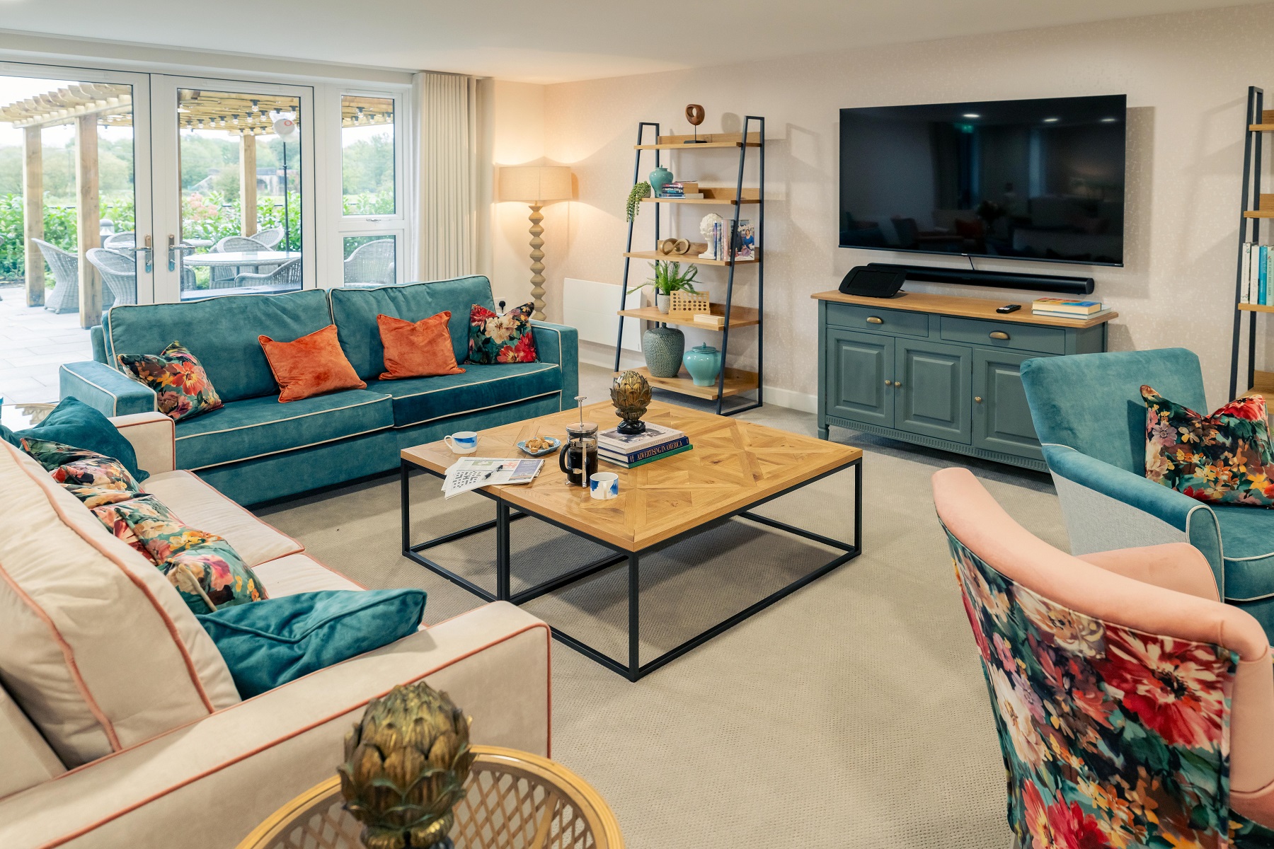 a living room with a blue couch and a coffee table