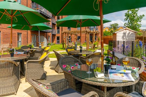 a patio with tables and chairs