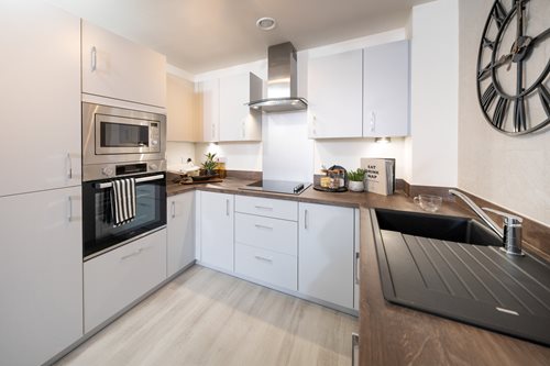 a kitchen with white cabinets