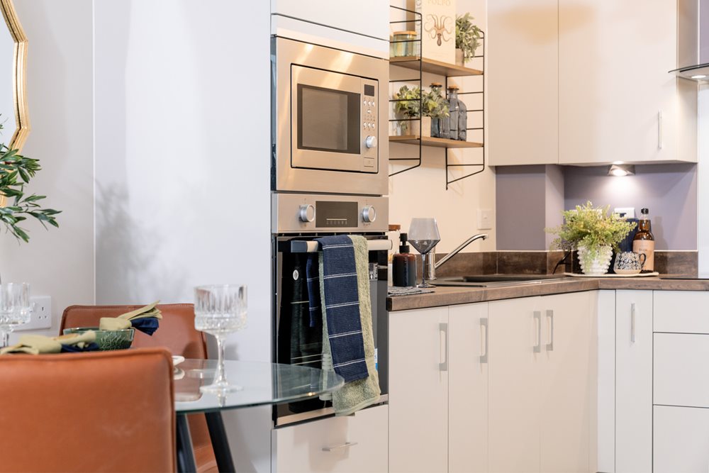 a kitchen with white cabinets