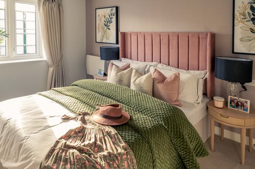 a bed with a hat on it