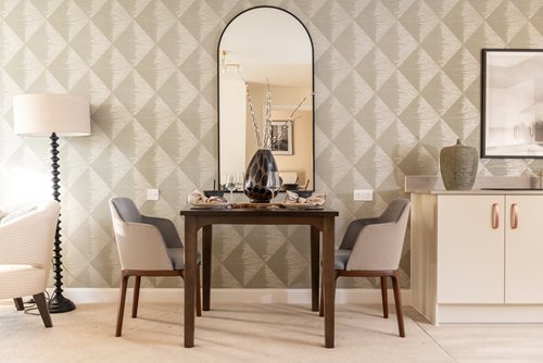 a room with a table and chairs