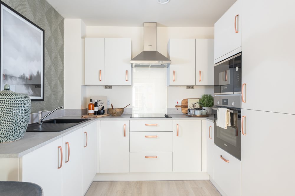 a kitchen with white cabinets