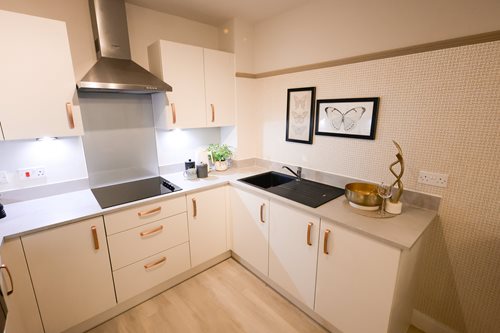 a kitchen with white cabinets