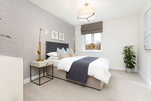a bedroom with a bed and a table