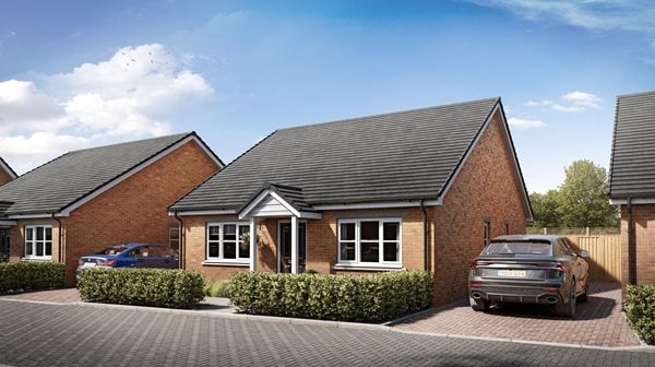 a brick house with a car parked in front of it