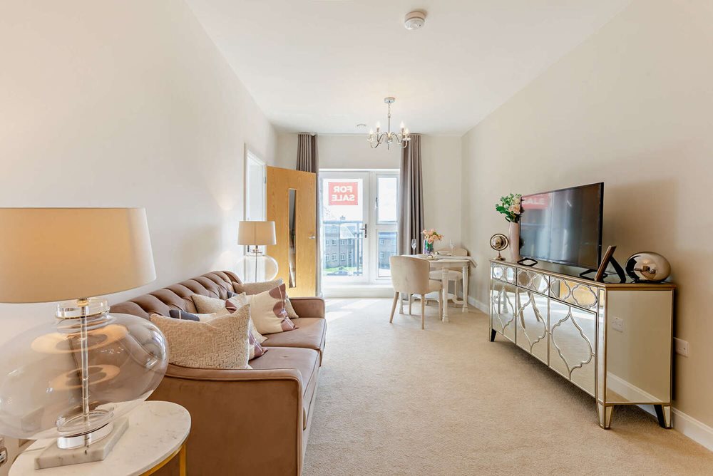 a living room with a tv and couches