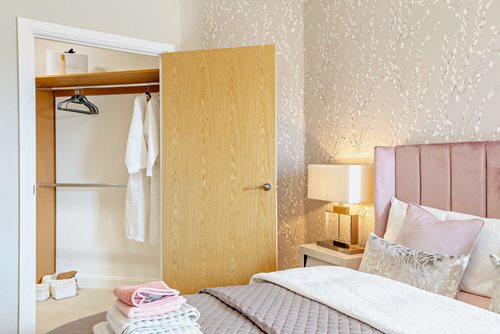 a bedroom with a bed and a closet