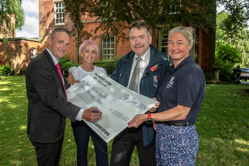 Handing over the cheque
