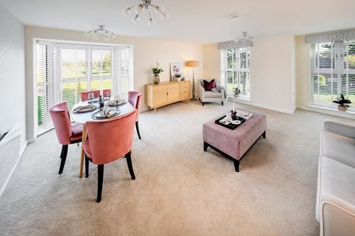 a large room with a table and chairs