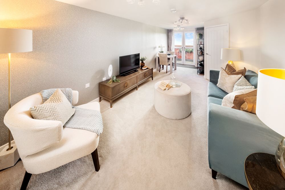 a living room with a tv and couches