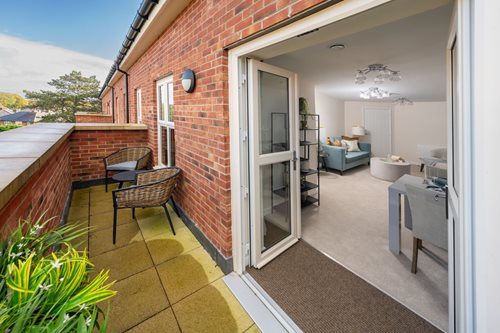 a house with a patio and a patio with a couch and chairs