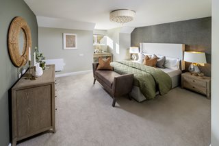 a bedroom with a bed and a couch