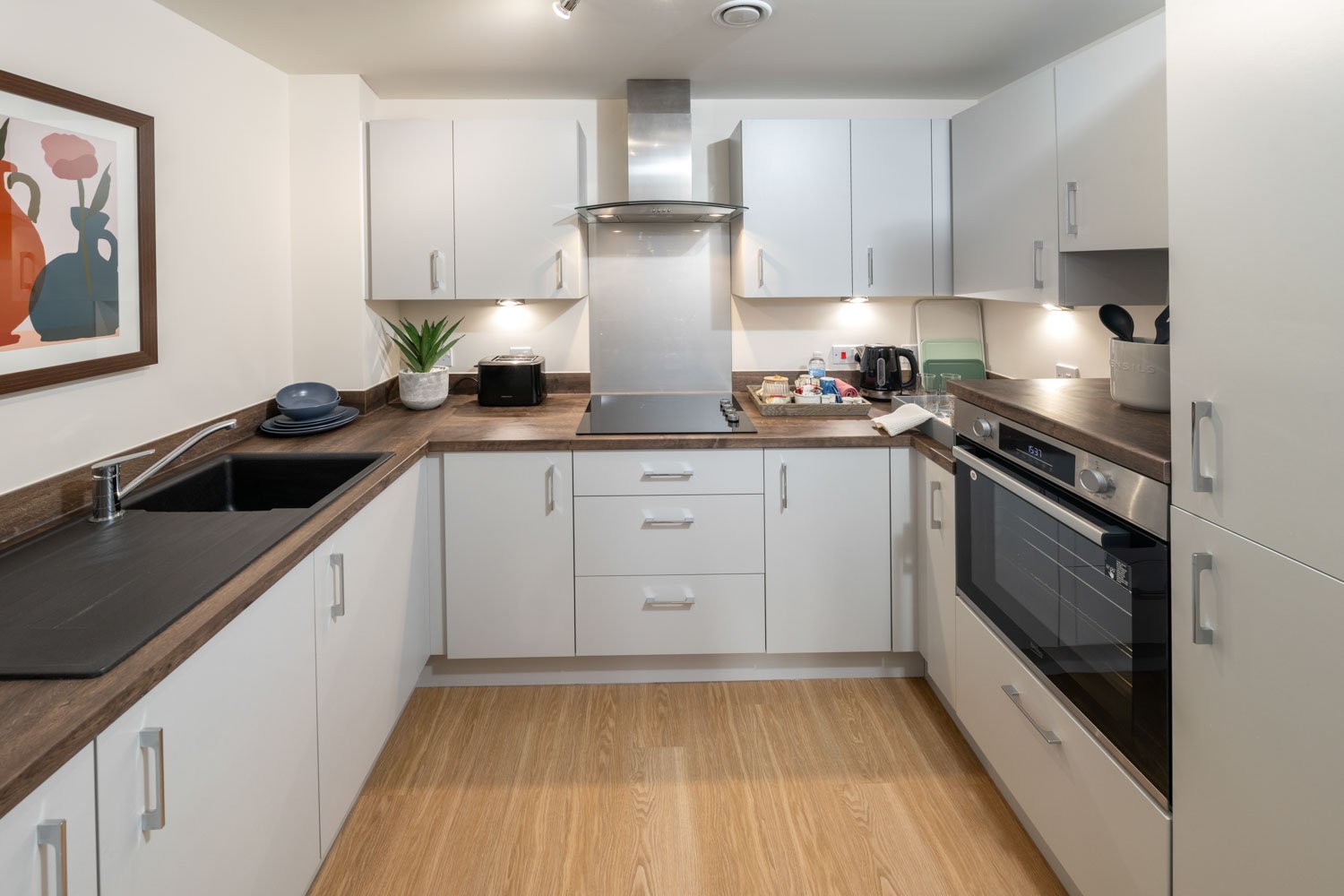 a kitchen with white cabinets