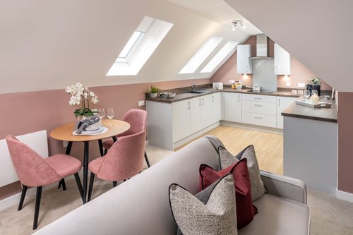 a room with a table and chairs