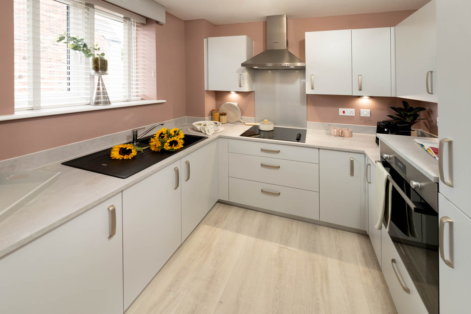 a kitchen with white cabinets
