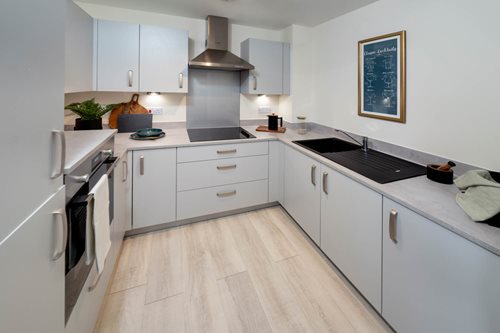 a kitchen with white cabinets