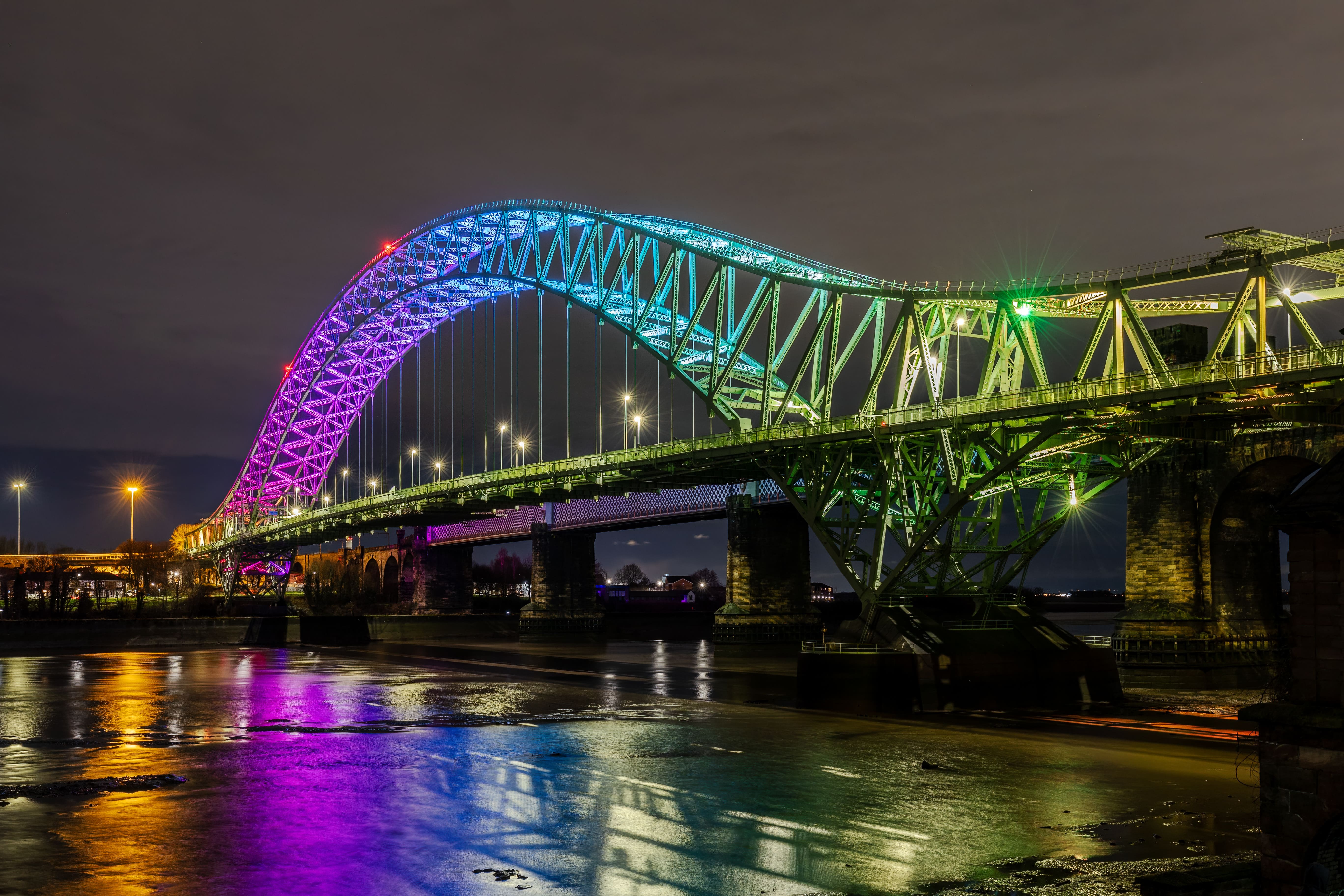 a bridge with lights at night