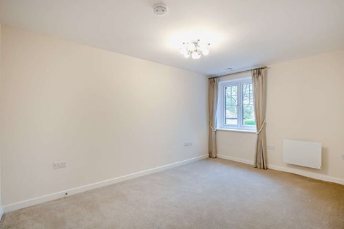 a room with a window and curtains