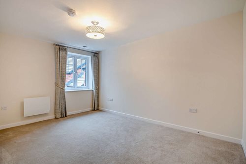 a room with a carpet and a window