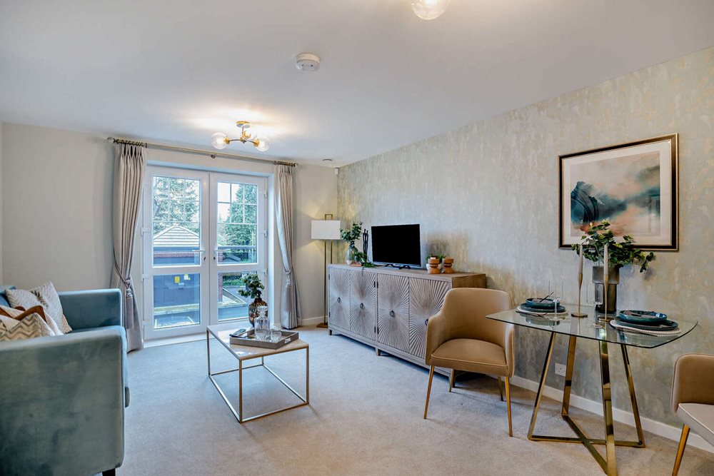 a living room with a tv and couches