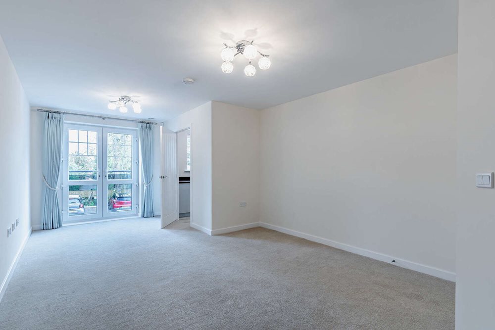 a room with a carpet and a window