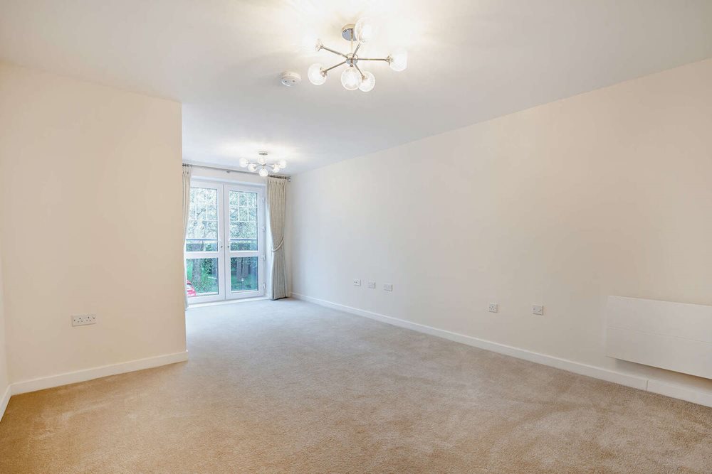 a room with a ceiling fan and a window